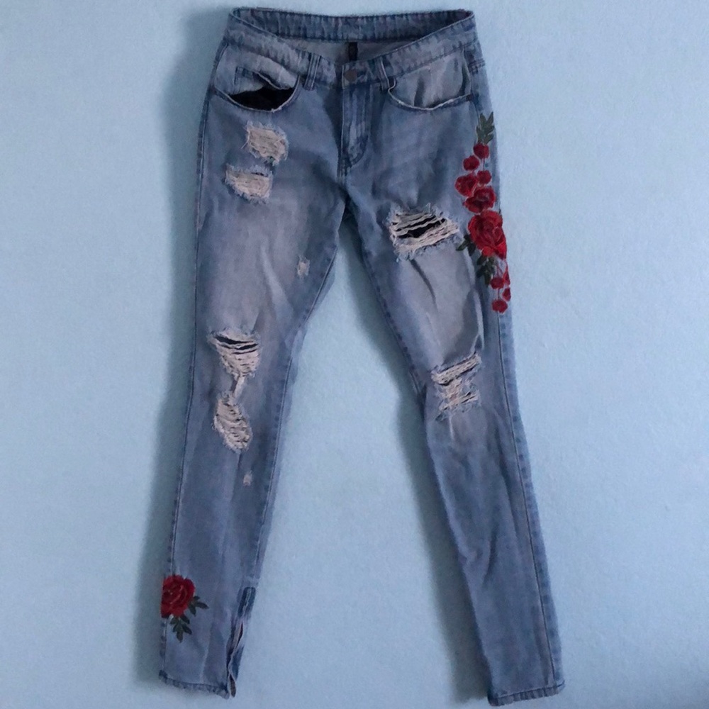 Light blue ripped jeans W/ roses